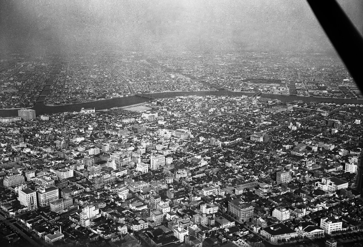 An area of Tokyo, seen from the sky on August 5, 1955. Modern buildings have wiped out the scars of flattened blocks.