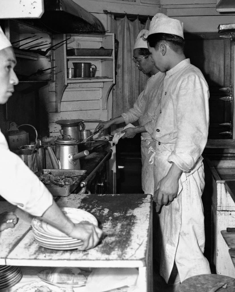 View of the kitchen on the Japan Railways Corporation express train with service to Kyoto, Osaka, and Kobe from Tokyo on April 19, 1950.