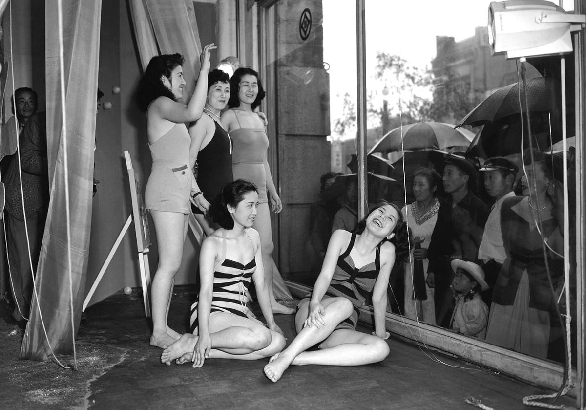 To draw the public's attention to a new line of bathing suits, a Tokyo department store used live models to show off the suits on June 5, 1950.