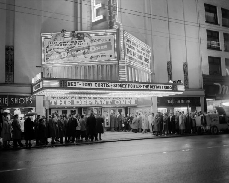 People lined up for the opening of the Defiant Ones at the Vogue Theatre, Vancouver, 1958