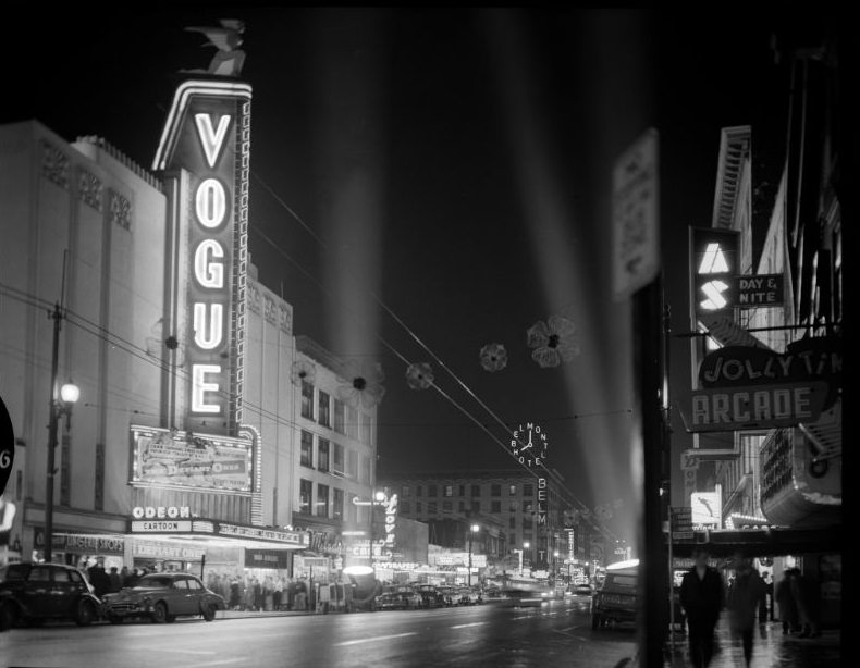 Vogue Theatre at night with spotlights, Vancouver, 1958