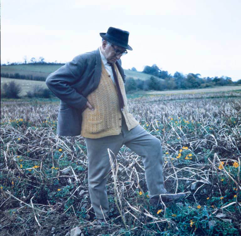 Poet Patrick Kavanagh eyeing the stony grey soil of Monaghan at his native Inniskeen, 1963