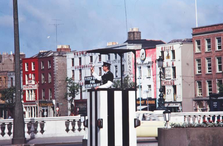 Garda directing traffic, O’Connell Bridge, Dublin. June 1963