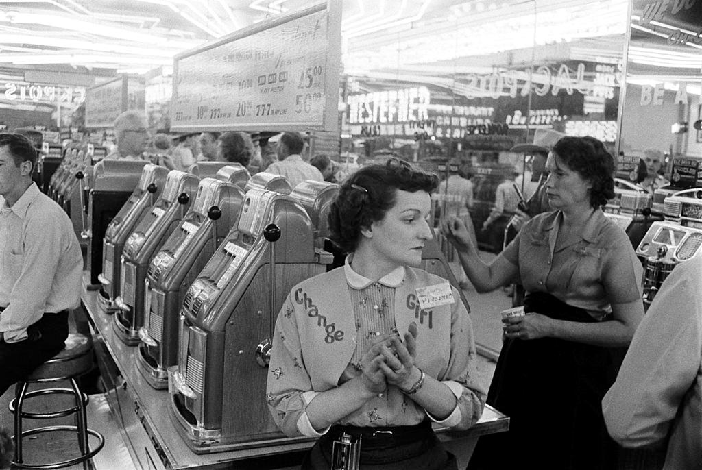 Customers at slot machines, Las Vegas, 1960s.