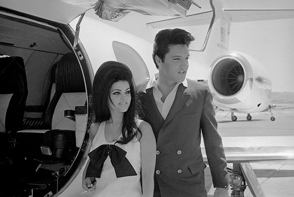 Newlyweds Elvis and Priscilla Presley,prepare to board their private jet following their wedding at the Aladdin Resort and Casino in Las Vegas, 1967.