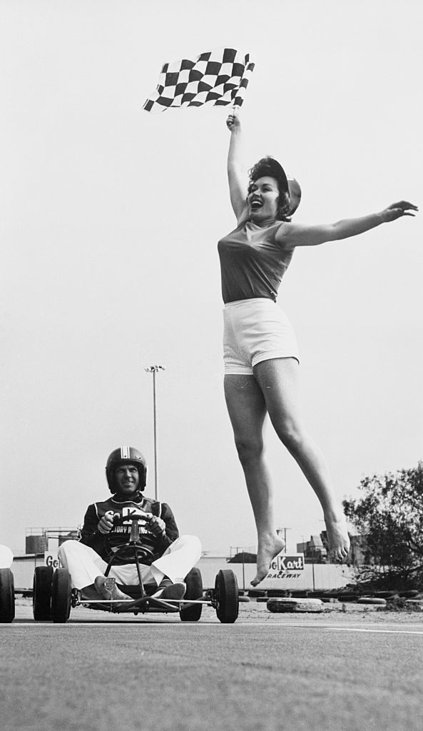 Kart Olympics Queen Rosalind Roberts Flagging to Start a Race, Las Vegas, 1961.
