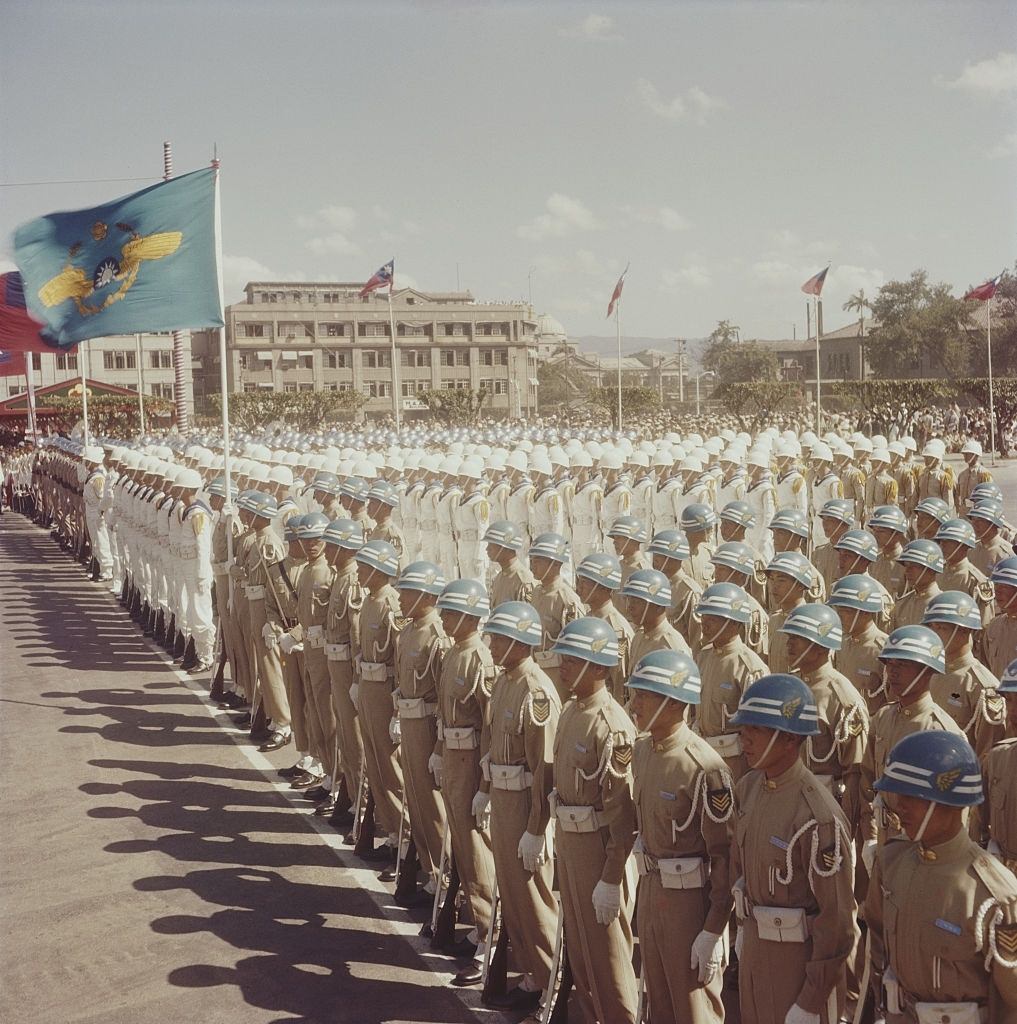 Armed Forces taking part in a military parade to commemorate Double Tenth anniversary celebrations in front of the Ministry of National Defense in Taipai, Taiwan circa 1960.