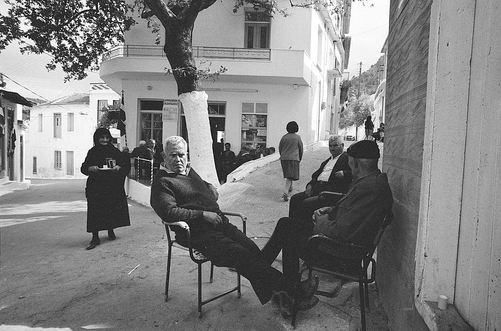Men sitting outside a cafe. Greece, 1970s