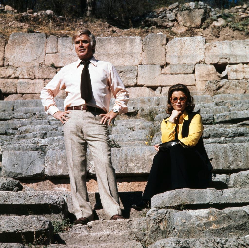 Joachim Fuchsberger and his wife Gundula sit together in the theater of Delphi, Greece 1970s.