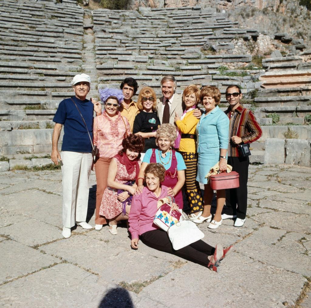 Joachim Fuchsberger poses with friends and colleagues for a group photo, circa 1970s.