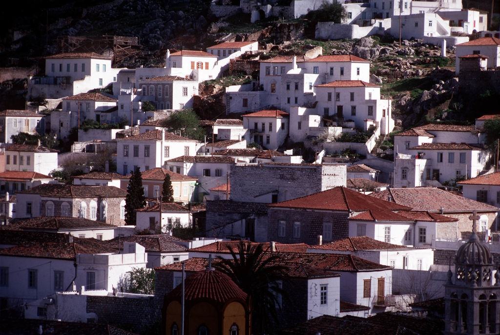 Houses on the hillside above the habour on the Greek island of Hydra, part of the Argo-Saronic group of Aegean islands.