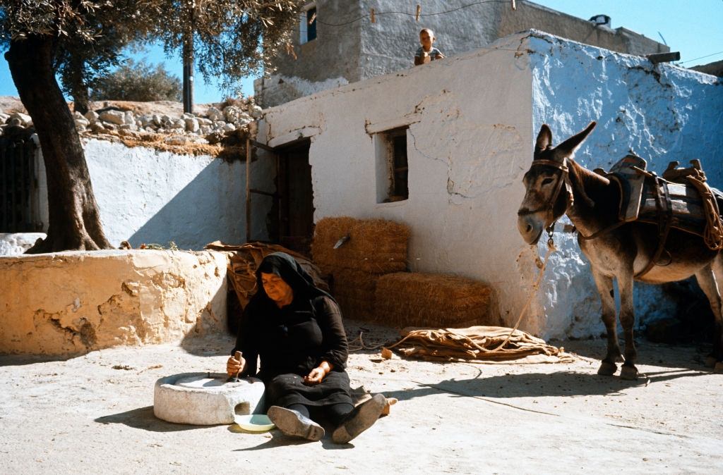 A woman Crinding corn, Zaros, Greece, 1970.