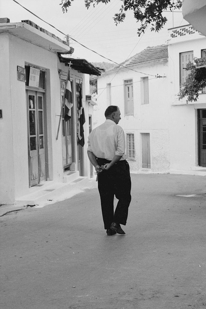 A man walking in the street. Greece, 1970s