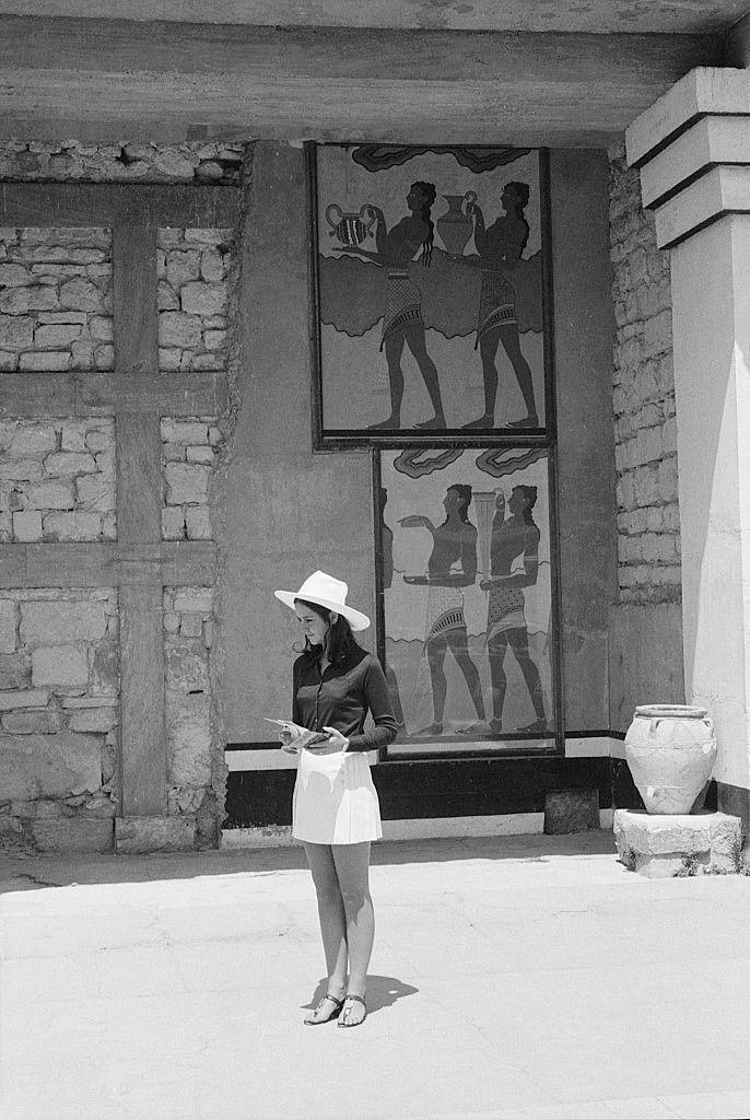 A tourist visiting the palace of Knossos - the main sight of the island of Crete. Crete, 1970s