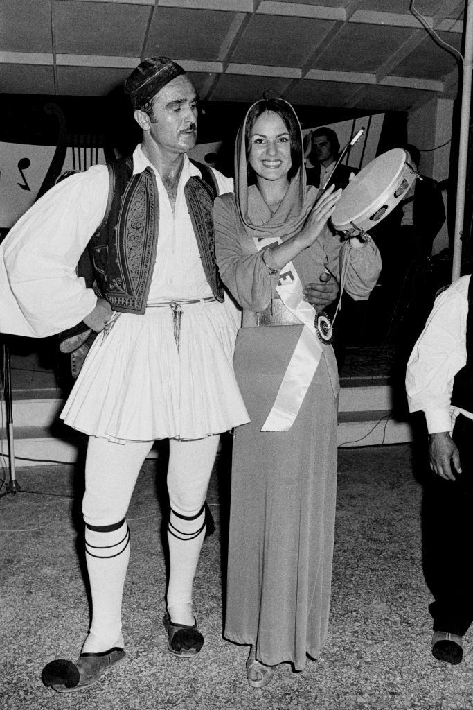 Nadia Isabelle Krumacker in Athens with a dancer in traditional costume, 1973.