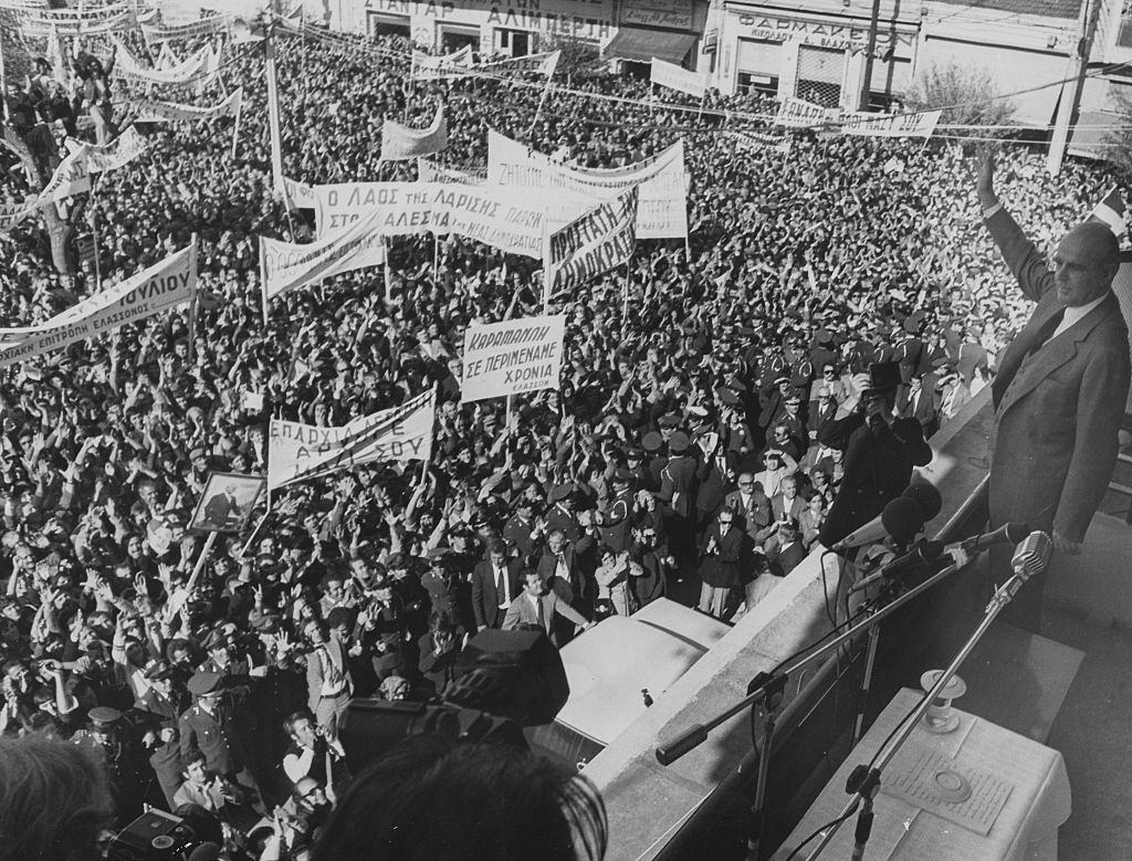 Politician Andreas Papandreou waving from a balcony following the fall of the Greek military Junta, during a political rally, 1974.