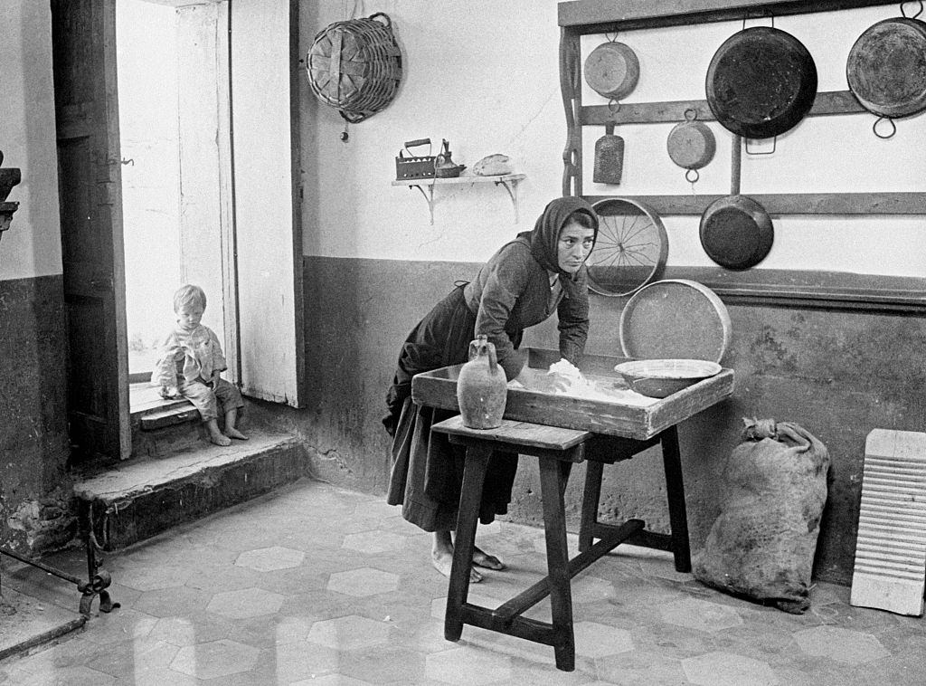 Greek actress Irene Papas kneading the dough in the film Christ Stopped at Eboli. Matera, 1978