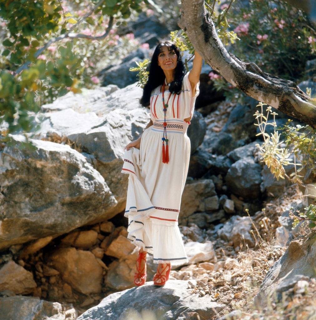 The German actress and singer Dunja Rajter poses on vacation for the camera, circa 1975.