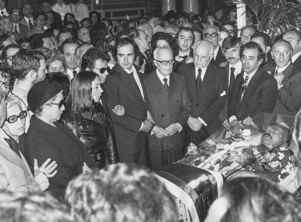 A crowd gathered around the open casket of Greek politician Alexandros Panagoulis at his funeral, 1976.