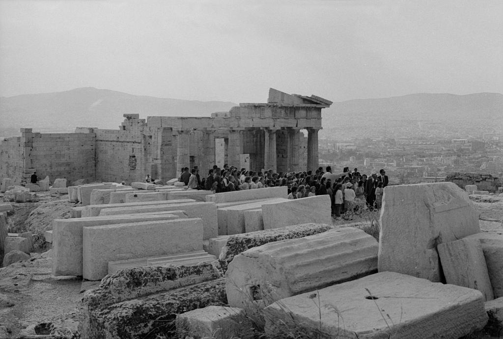 Tourists visiting an archaeological site. Greece, 1970s