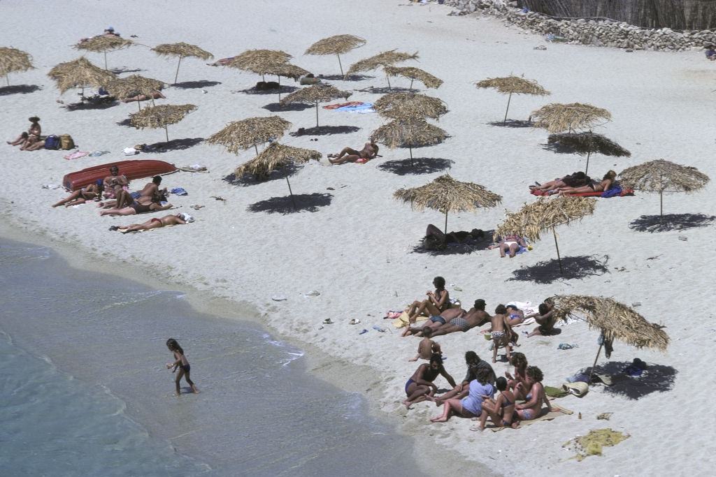 Umbrellas on the beach in Myconos in August 1978 in Greece.