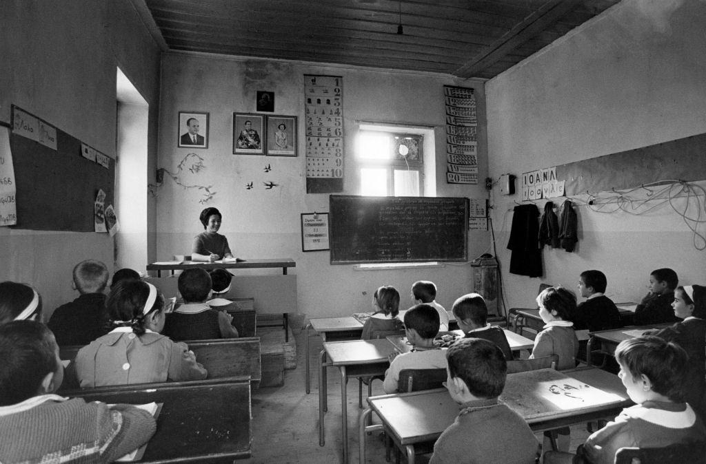 Students of a Greek primary school listening to the theacher during a class. Elaiochori, 1970