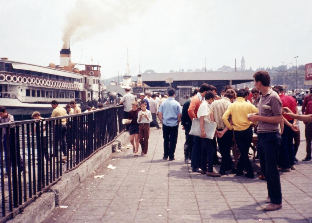 Crowds of tourists and locals gather near Galata Bridge, Istanbul, 1970.