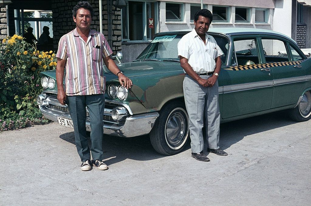 Two Turkish men stand outside a guesthouse in Istanbul, July 1970