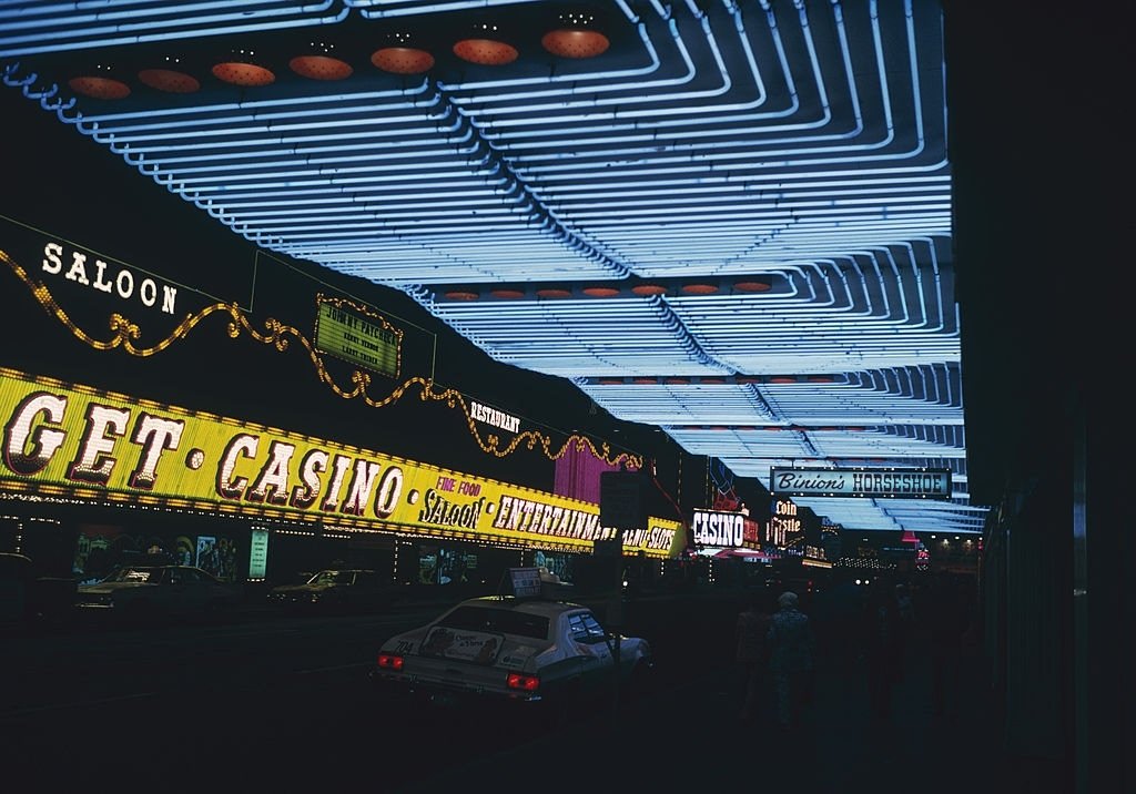 Neon signs advertising the casinos and saloons of Las Vegas, outside Binion's Horseshoe Hotel, 1975.