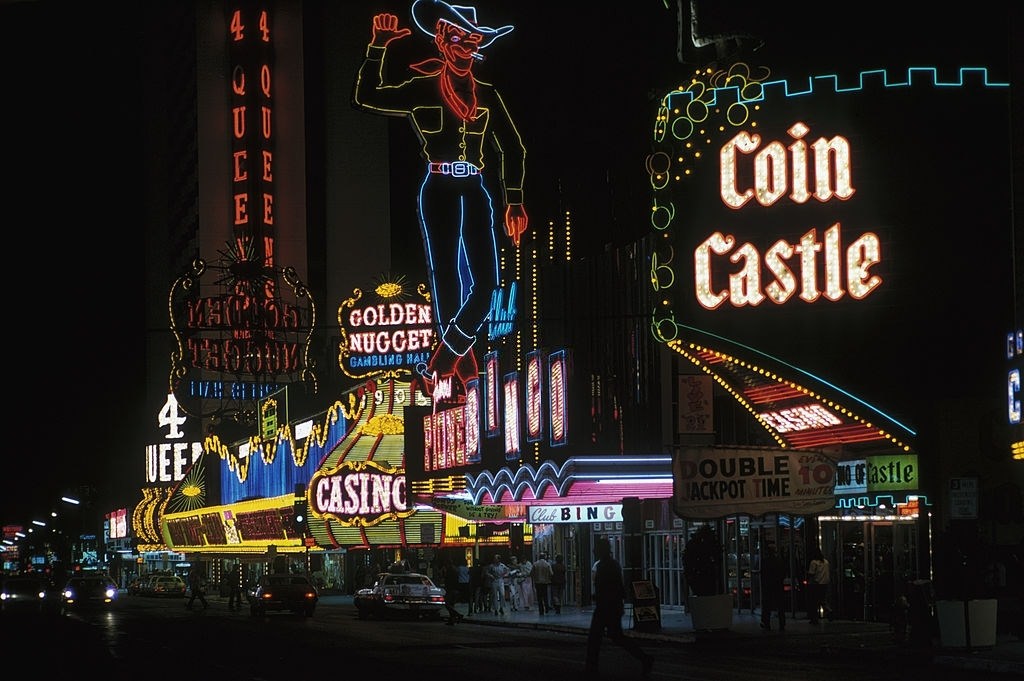 Coin Castle, a waving cowboy sign, and the Golden Nugget hotel in Las Vegas, March 1975.