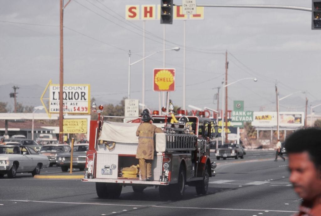 Firefighters and fire engine in the streets of Las Vegas, 1975.