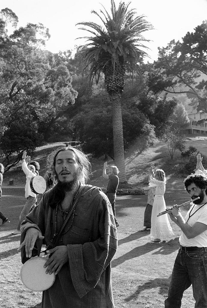 Devotees singing ang playing instruments in a hippy commune, San Francisco, 1971.