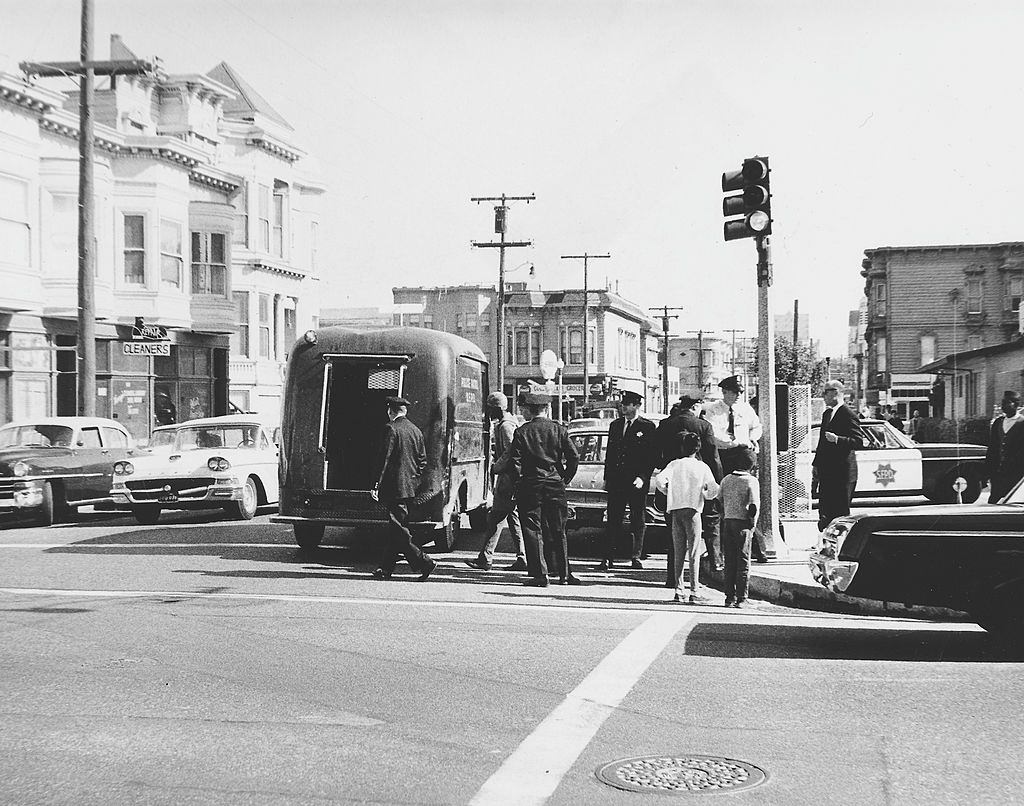 Police officer arresting protestors in a street, San Francisco, 1970.
