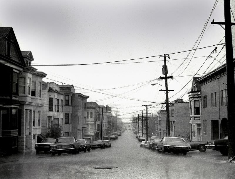Looking west at 23rd and Hampshire in the Mission district during a winter rainstorm, San Francisco, 1978