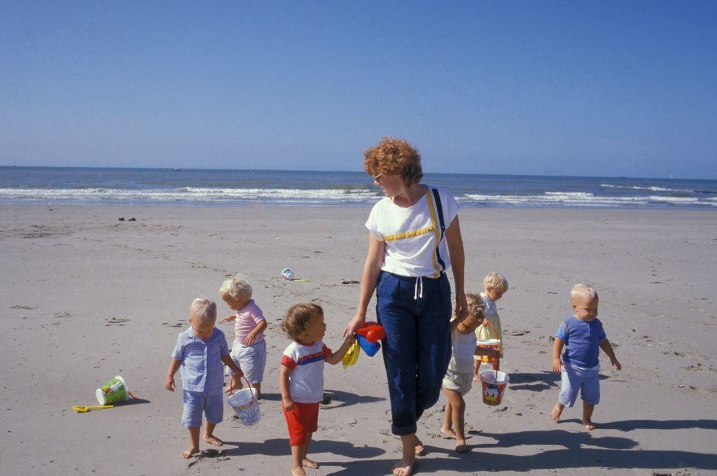Six-fold children on the beach in Belgium, September 1985.