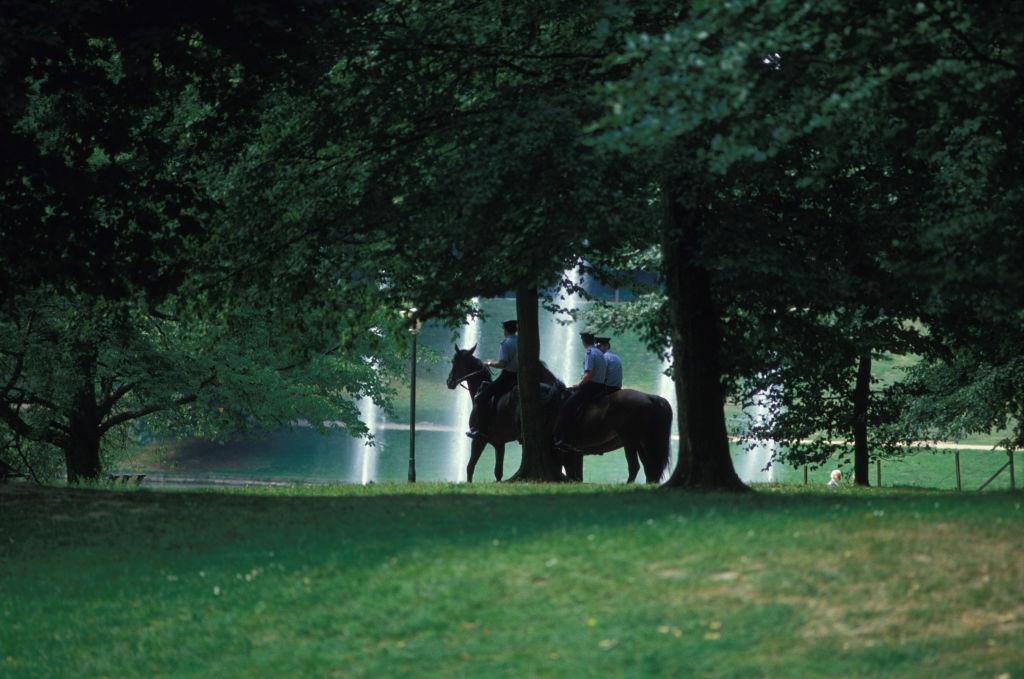 Policemen riding on the horses in the Bois de Cambre in Brussels in August 1986.