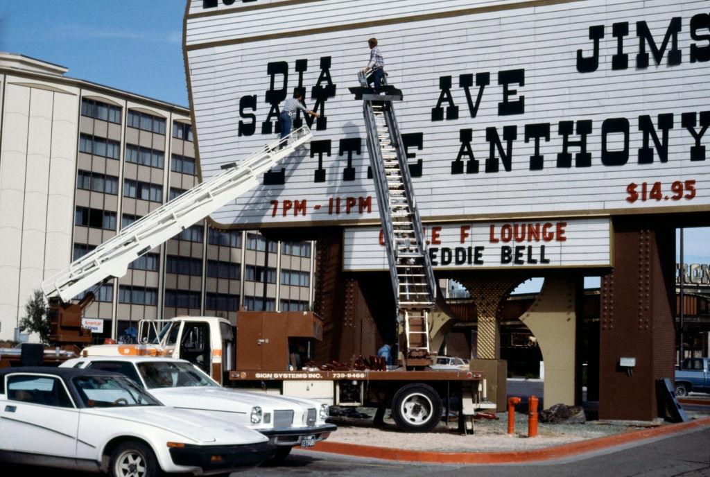 Change of letters announcing a show on the pediment of a casino in Las Vegas, 1982.