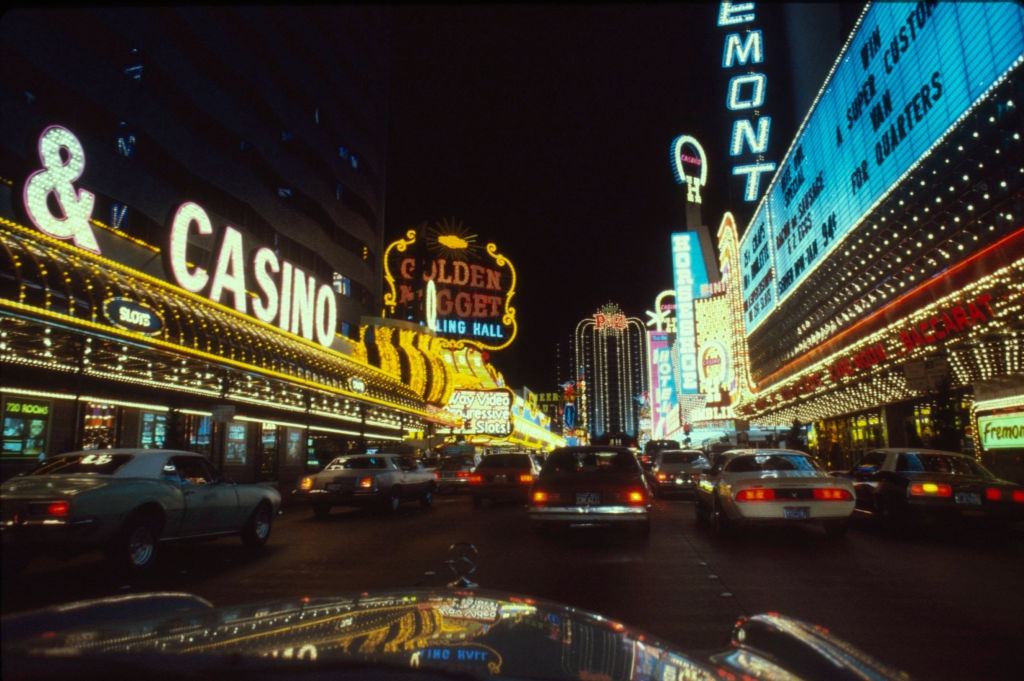 Nighttime view, looking east, of hotels and casinos on Fremont Street, Las Vegas, 1983.