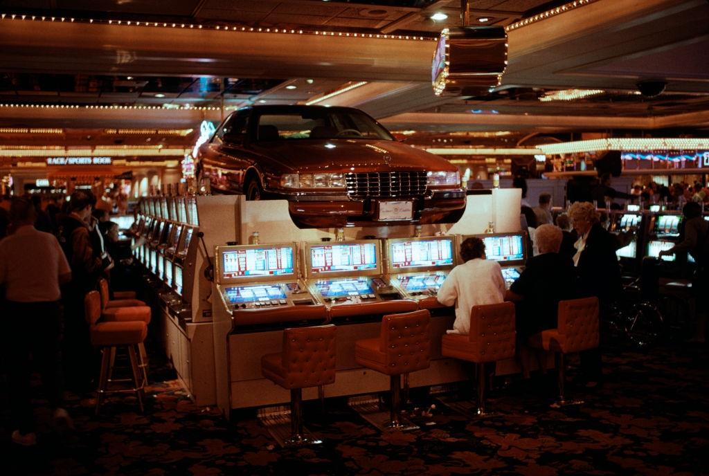 Car and slot machines inside a casino in Las Vegas, 1984.