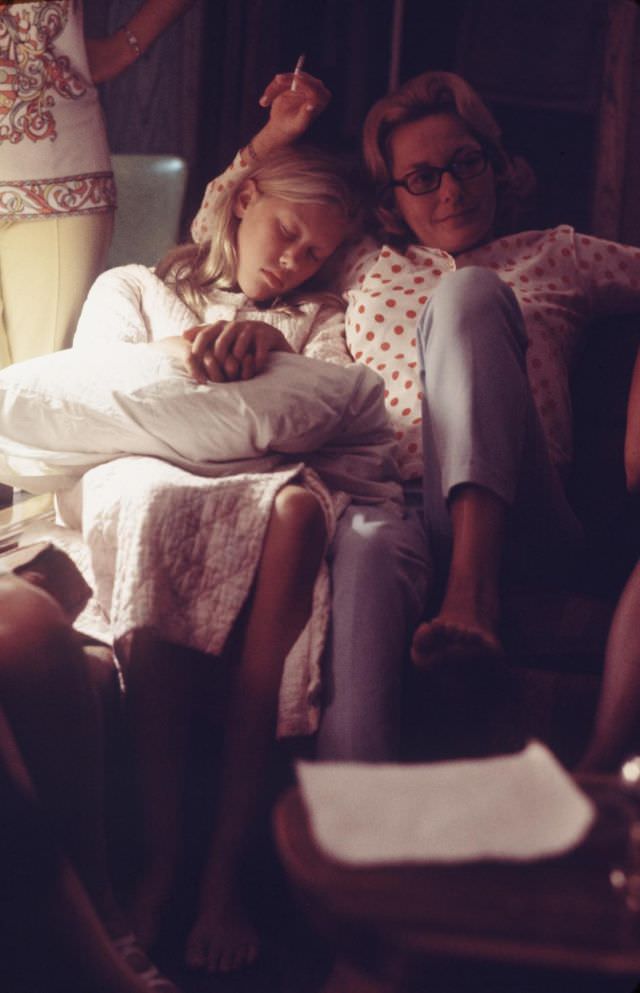 Joan Aldrin at home watching her husband’s moon mission via live T.V. transmission. Their daughter Jan, age 11, has fallen asleep.