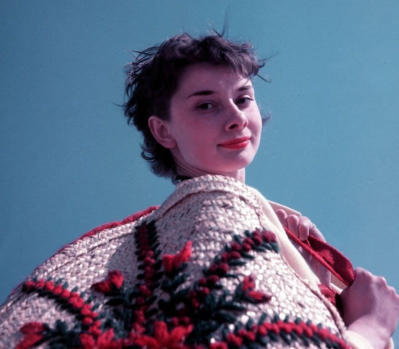 Audrey Hepburn relaxing by the coast, 1951.