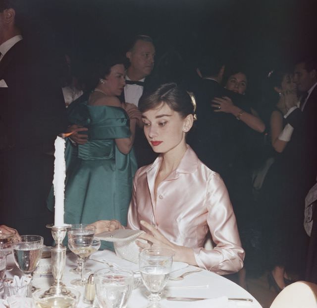 Audrey Hepburn, at the Lido nightclub in Paris, 1955.