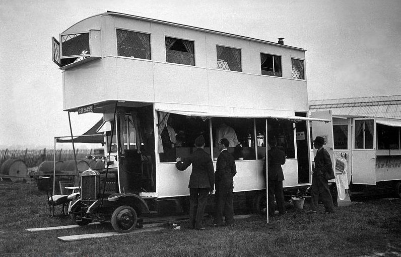 Customers buying snacks at the bar of a bus.