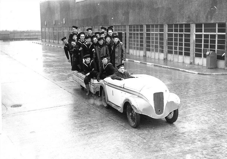 Navy recruits riding in car and trailer at the HMS Royal Arthur training centre formerly Butlin's holiday camp, Skegness.