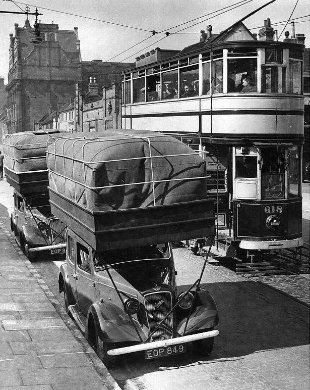 Gas-driven taxis in a street in Birmingham .