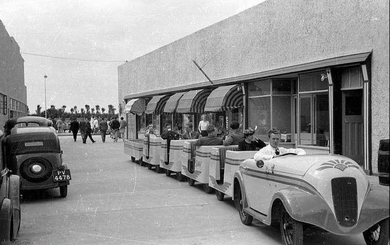 Holidaymakers riding the “train” at Butlin's Holiday Camp, Skegness, Lincolnshire .