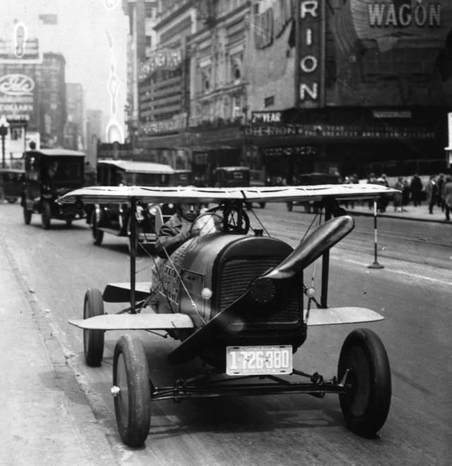 A car with wings and a propeller on TImes Square, New York, 1924