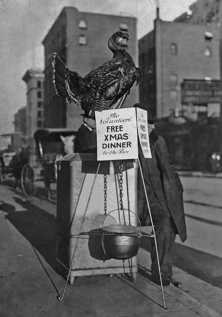A turkey and a cauldron are used to advertise a free Christmas dinner to be provided to the poor by the charity Volunteers of America, Denver, 1905