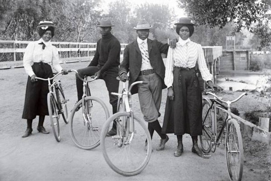Four cyclists stop for a photograph on the Alameda Avenue Bridge, Denver, 1905.