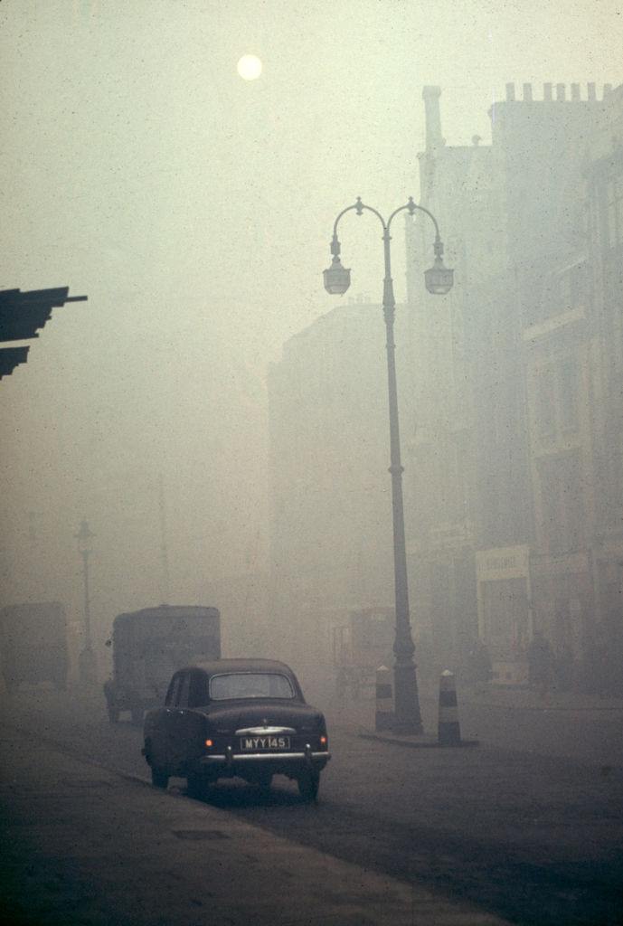 View along a foggy street, London, 1952.